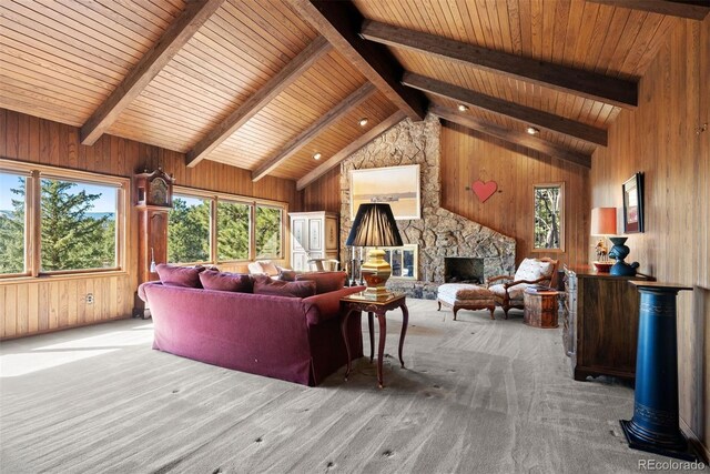 living area with carpet flooring, a fireplace, and wooden walls