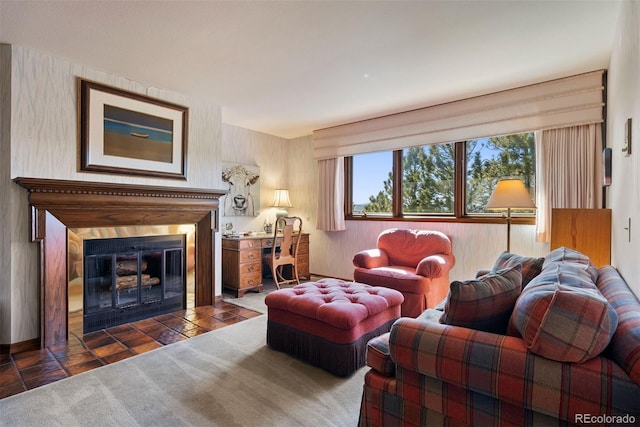 living room with a glass covered fireplace