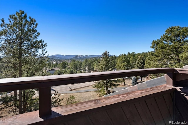 view of mountain feature with a view of trees