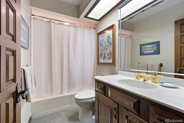 bathroom featuring shower / tub combo with curtain, vanity, toilet, and tile patterned floors