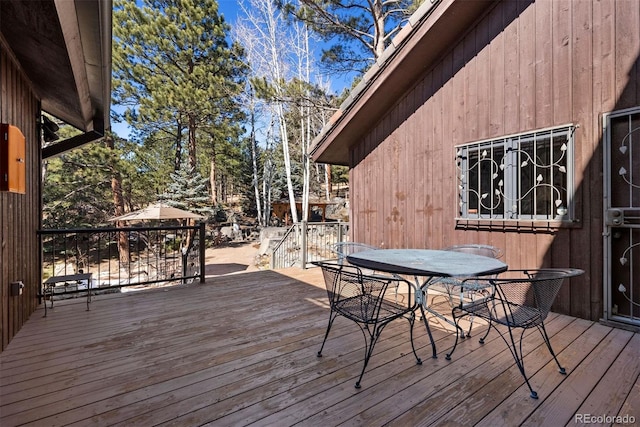 wooden deck with outdoor dining space