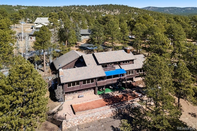 drone / aerial view featuring a view of trees