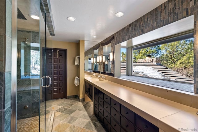 2851 Interlocken Dr, Evergreen, CO 80439 - full bath with vanity, recessed lighting, a shower stall, and stone finish floors