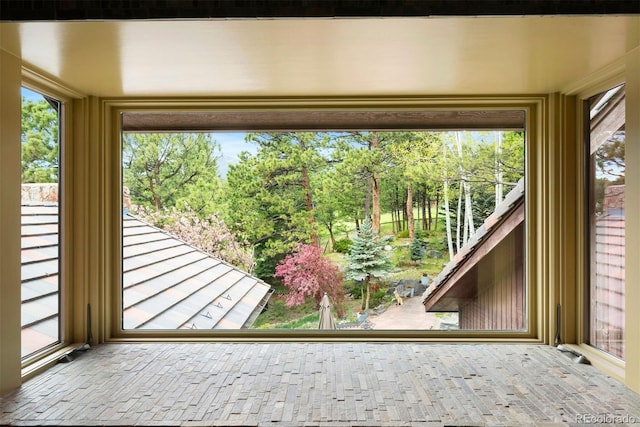 2851 Interlocken Dr, Evergreen, CO 80439 - unfurnished sunroom with view of wooded area