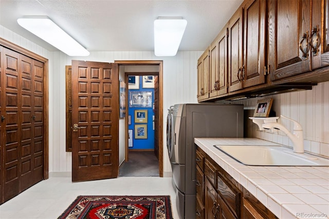 2851 Interlocken Dr, Evergreen, CO 80439 - washroom featuring cabinet space and washer and dryer