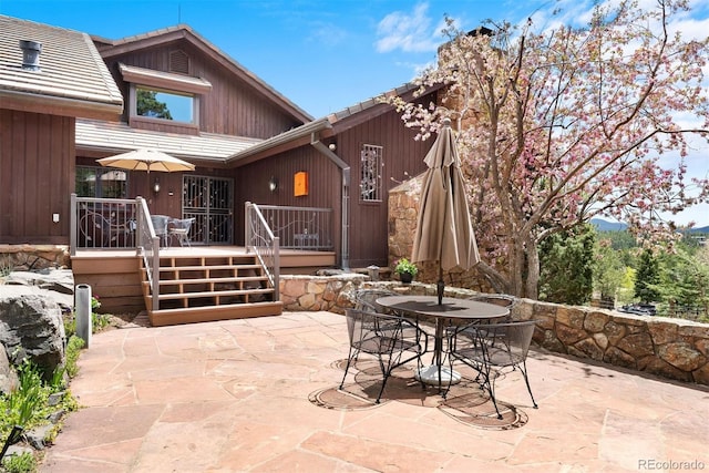 2851 Interlocken Dr, Evergreen, CO 80439 - view of patio with outdoor dining space and a deck