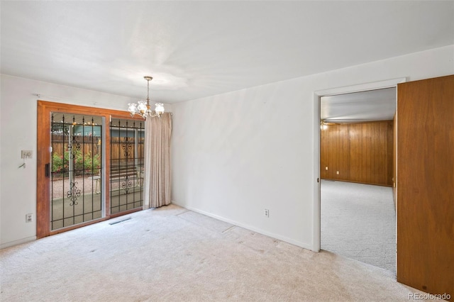 2043 Patrician Way, Colorado Springs, CO 80909 - unfurnished room featuring carpet floors, a chandelier, and baseboards