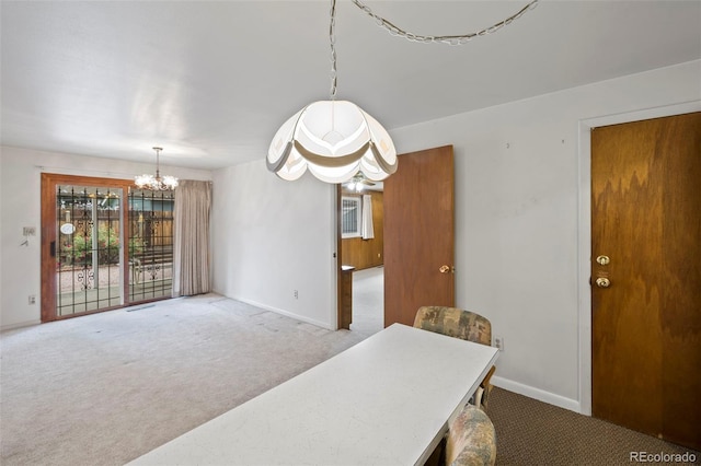 2043 Patrician Way, Colorado Springs, CO 80909 - carpeted dining room featuring a chandelier and baseboards