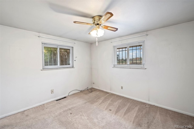2043 Patrician Way, Colorado Springs, CO 80909 - spare room with healthy amount of natural light, carpet floors, ceiling fan, and baseboards