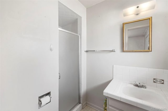 2043 Patrician Way, Colorado Springs, CO 80909 - full bath featuring a stall shower, vanity, and baseboards