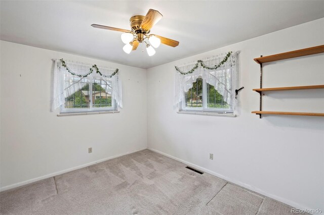 2043 Patrician Way, Colorado Springs, CO 80909 - spare room featuring carpet, baseboards, and a ceiling fan