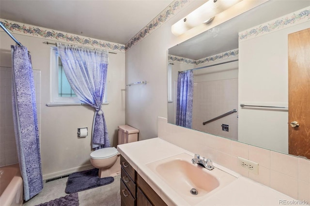 2043 Patrician Way, Colorado Springs, CO 80909 - full bath with vanity, toilet, shower / bath combination with curtain, backsplash, and baseboards