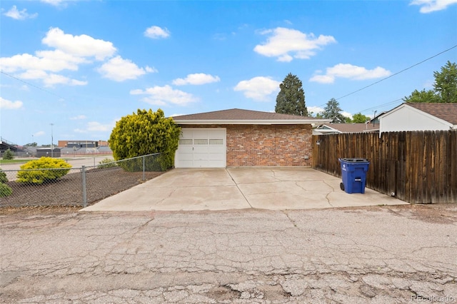 2043 Patrician Way, Colorado Springs, CO 80909 - garage with concrete driveway