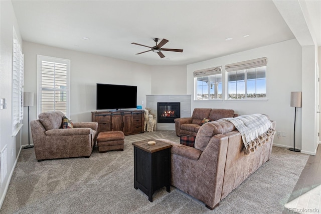 living room with ceiling fan and light wood-type flooring