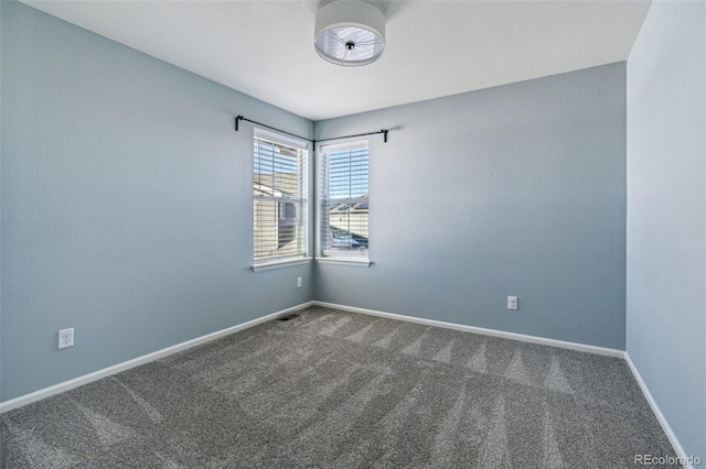 unfurnished room featuring carpet flooring