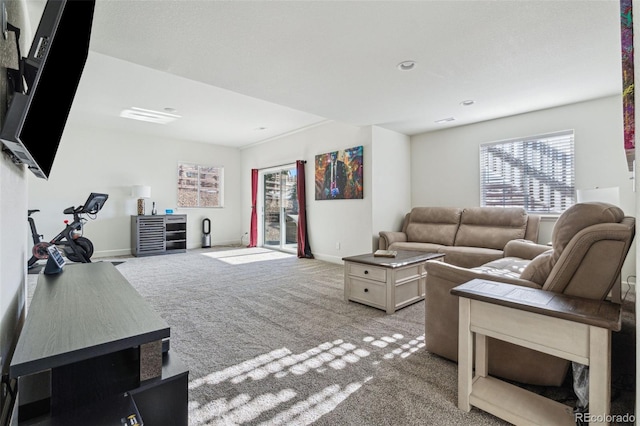 carpeted living room featuring a wealth of natural light