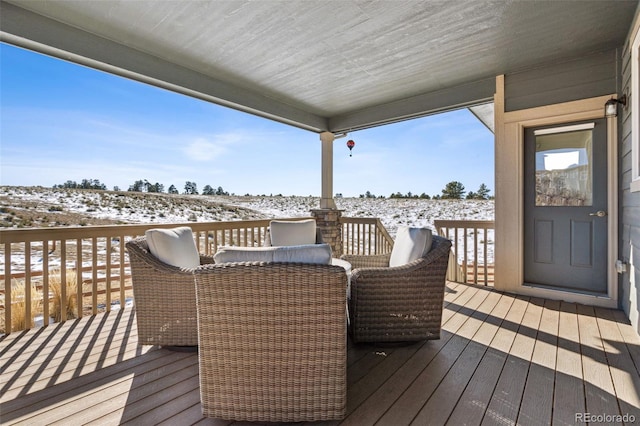 view of snow covered deck