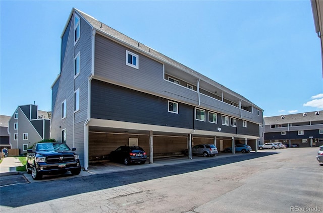 view of property with covered parking