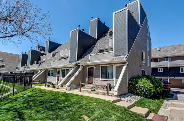 rear view of property featuring entry steps and a chimney