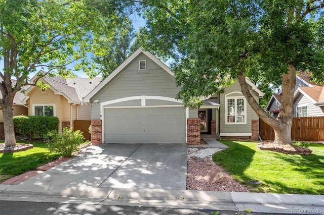 view of front of property featuring a front lawn and a garage