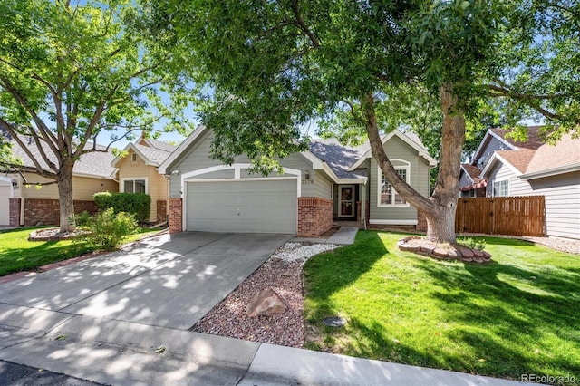 view of front of property with a front yard and a garage