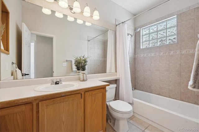 full bathroom with tile patterned floors, vanity, toilet, and shower / bath combo