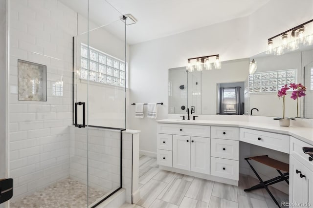 bathroom with vanity and walk in shower