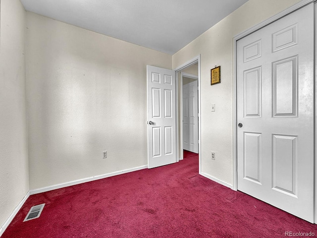 778 S Fairplay Ct, Aurora, CO 80012 - unfurnished bedroom with dark carpet and baseboards