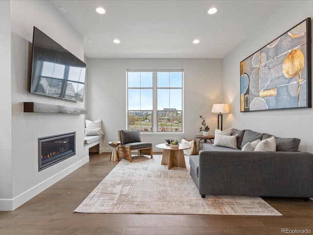 9378 E 60th Pl, Denver, CO 80238 - living room with a glass covered fireplace, baseboards, recessed lighting, and wood finished floors