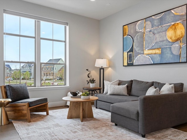 9378 E 60th Pl, Denver, CO 80238 - living area featuring baseboards and a wealth of natural light