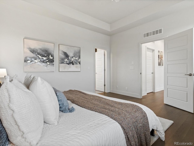 9378 E 60th Pl, Denver, CO 80238 - bedroom with visible vents, baseboards, and wood finished floors