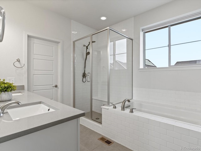 9378 E 60th Pl, Denver, CO 80238 - full bath featuring tile patterned flooring, a garden tub, visible vents, a sink, and a stall shower
