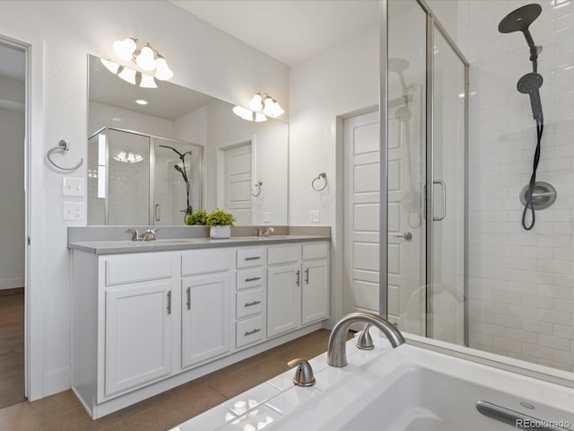 9378 E 60th Pl, Denver, CO 80238 - bathroom featuring a sink, a shower stall, and double vanity