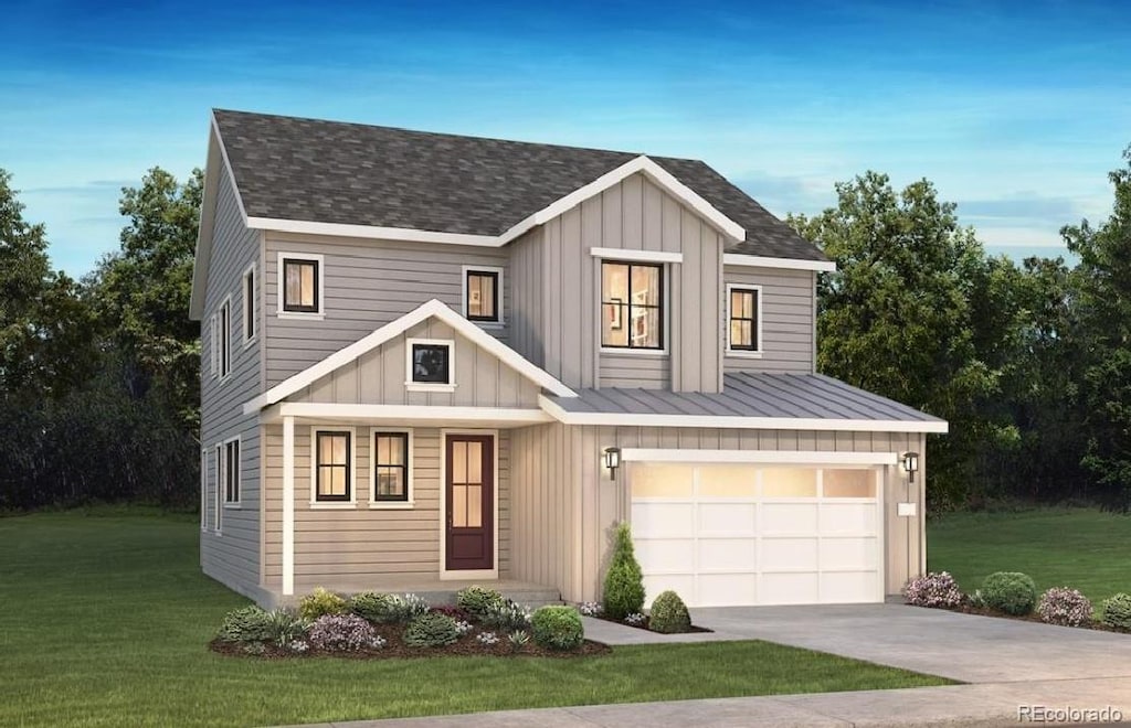 view of front of home featuring a garage and a front yard