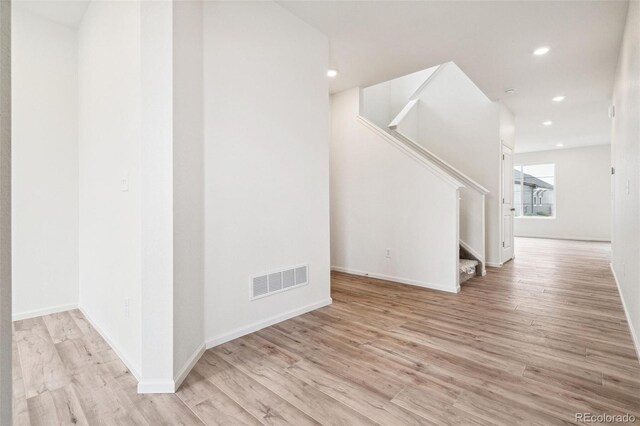 unfurnished living room with light hardwood / wood-style flooring