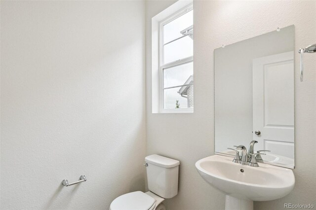 bathroom with toilet and sink