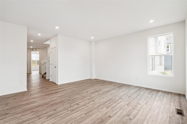 unfurnished room featuring light hardwood / wood-style flooring