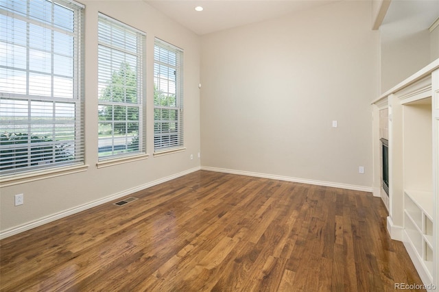 1067 Uinta Way Unit 1067, Denver, CO 80230 - empty room with wood finished floors, a fireplace, and recessed lighting