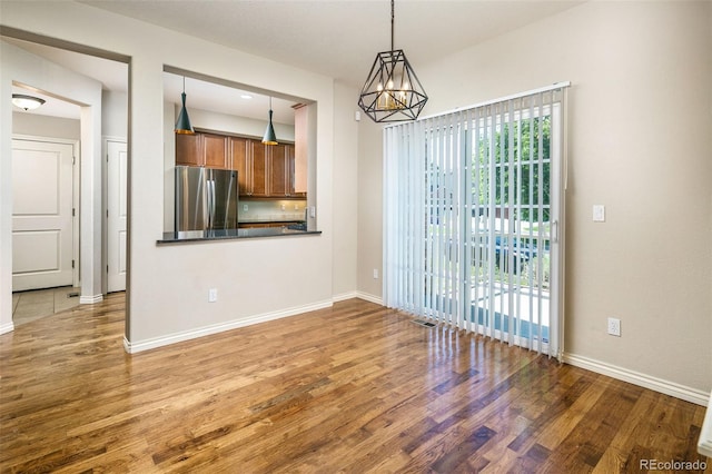 1067 Uinta Way Unit 1067, Denver, CO 80230 - unfurnished dining area with wood finished floors and a chandelier