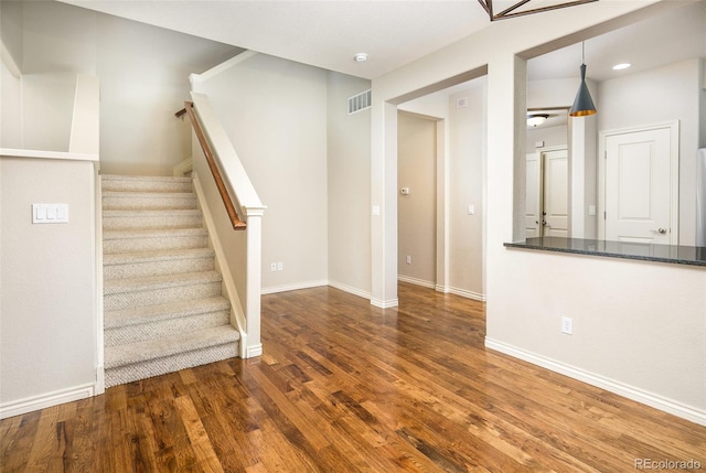 1067 Uinta Way Unit 1067, Denver, CO 80230 - stairway featuring wood finished floors and recessed lighting
