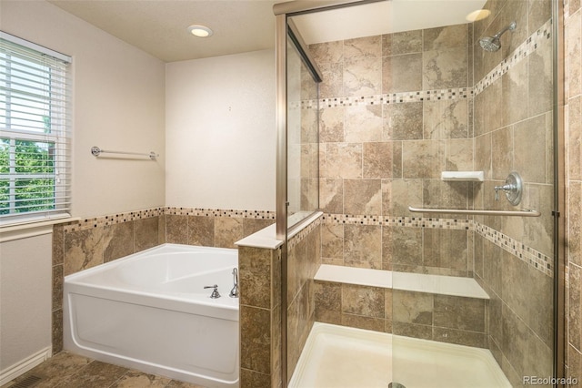 1067 Uinta Way Unit 1067, Denver, CO 80230 - full bathroom featuring a stall shower, a garden tub, and plenty of natural light