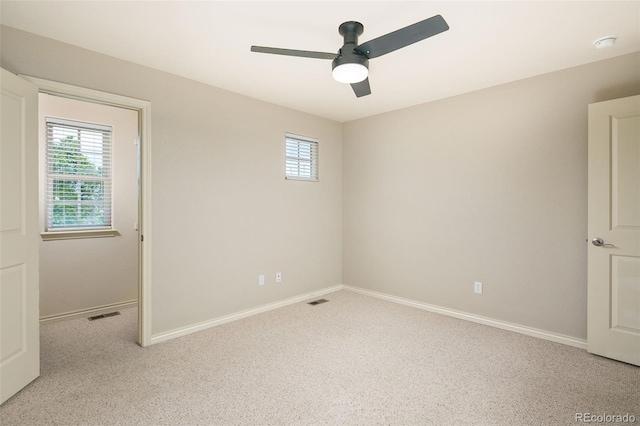 1067 Uinta Way Unit 1067, Denver, CO 80230 - spare room featuring ceiling fan, a smoke detector, and carpet flooring