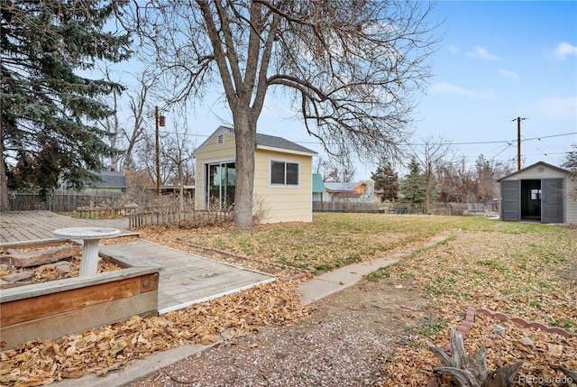 view of yard featuring a shed and a deck