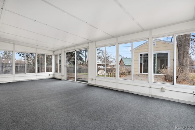 unfurnished sunroom featuring a healthy amount of sunlight