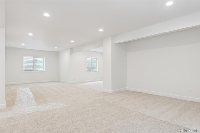 8205 Cokedale Cir, Littleton, CO 80125 - basement featuring light colored carpet, recessed lighting, baseboards, and plenty of natural light
