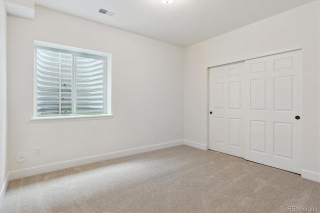 8205 Cokedale Cir, Littleton, CO 80125 - unfurnished bedroom with carpet floors, baseboards, and a closet