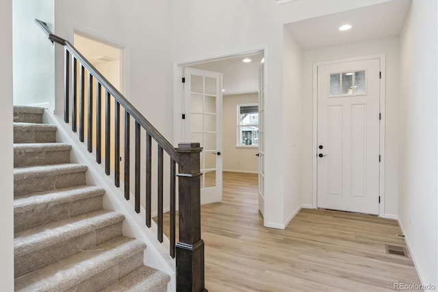 8205 Cokedale Cir, Littleton, CO 80125 - entrance foyer featuring stairs, baseboards, light wood finished floors, and recessed lighting