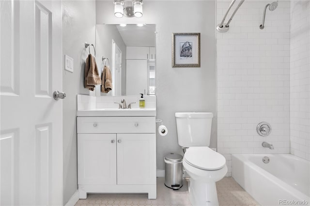 full bathroom featuring tile patterned flooring, vanity, toilet, and tiled shower / bath