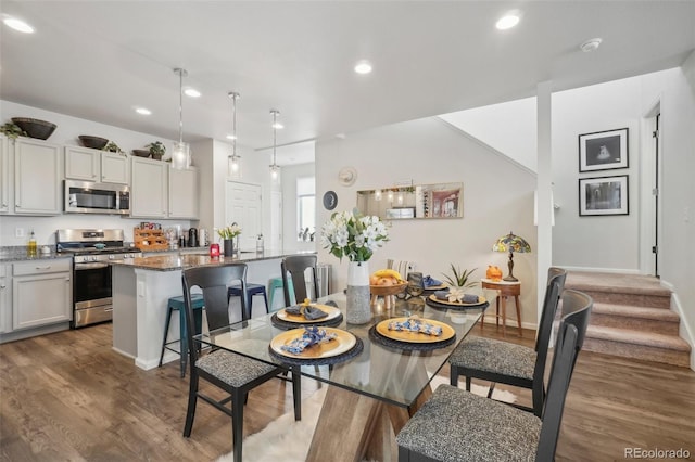 dining room with dark wood-type flooring