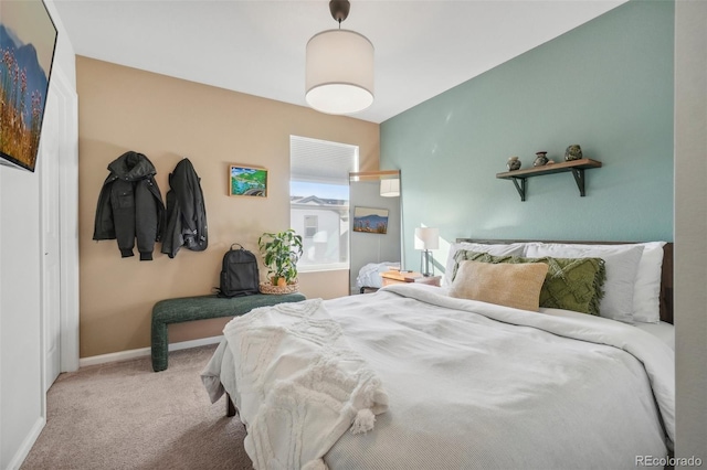 bedroom featuring light carpet